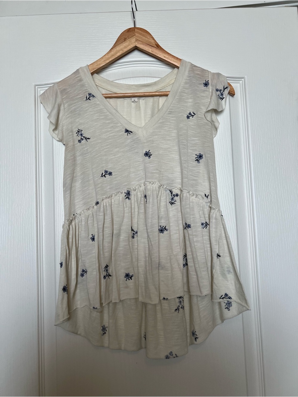 Cream V-Neck Peplum Tunic with Navy Floral Detail
